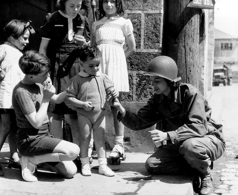 Nurse giving candy to kids